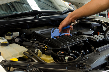 Cleaning Car Engine By Air Gun Pressure.の写真素材