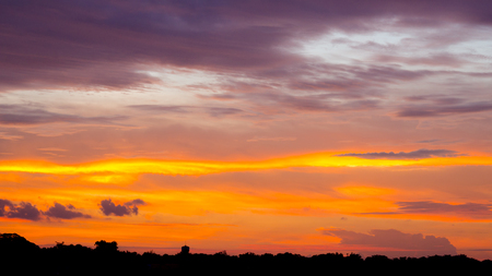 Beautiful red sky sunset with clouds and light rayの写真素材