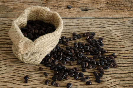 Cup Of Coffee On Wood Table With Coffee Beans.の写真素材