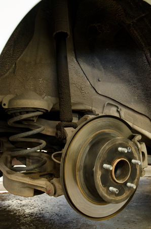 Car mechanic changing Shock Absorber in professional car repair serviceの写真素材