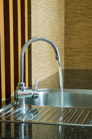 Water Running From Tap Of Sink, Closed Upの写真素材