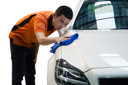 Worker Wiping White Car Surface With Blue Microfiberの写真素材