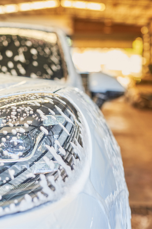 Bubble Wash Foam On White Car Surface, Car Washing.の写真素材