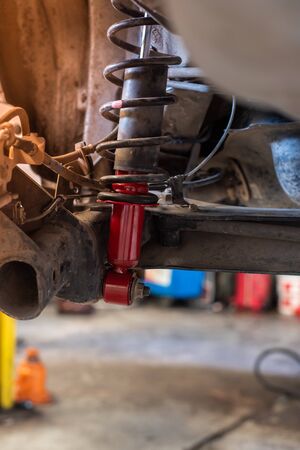 Car Changing New Red Car Absorber In Auto-Repair Service.の写真素材