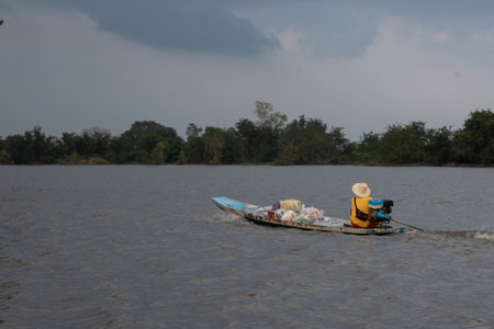 UBON RATCHATHANI, THAILAND- SEPTEMBER 22 : People Ride On Boat In Flood Area On September 22, 2019 In Warin Chumrab District Ubon Ratchathani Province, Thailandのeditorial素材