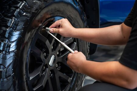 Professional Checking Tire Pressure By Manual Machineの写真素材