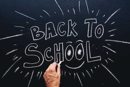 Back to School written on classroom chalkboard, new semester is startingの写真素材