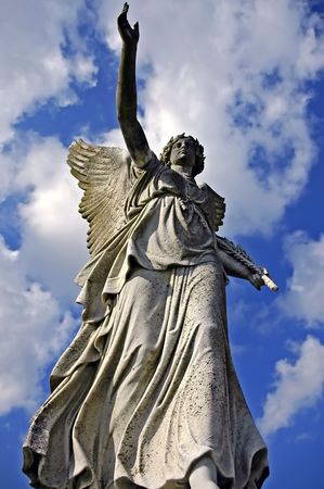angelic victory statue on the sky backgroundの写真素材