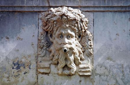 artistic relief of the head on the fountain in Alhambra, Spainのeditorial素材