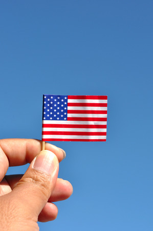 american flag in blue sky patriotic backgroundの写真素材