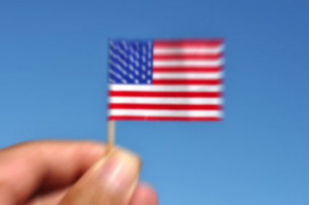 defocused usa flag in blue sky patriotic background