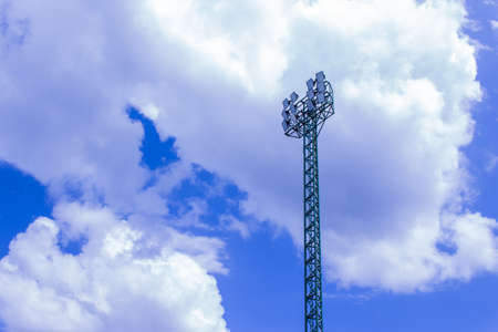 Spotlights pole with a bright sky in the day の写真素材