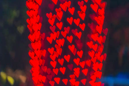 Cute heart shaped bokeh light at night.の写真素材