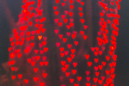 Cute heart shaped bokeh light at night.の写真素材