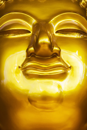 The Buddha represents the meaning of Buddhism, the Buddha looks golden yellow, shining with light, and then look luxurious.の写真素材