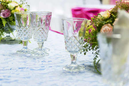 Elegant party is tastes of the people, sparkling crystal glass, floral ornament adds romance, perfect decoration. Bright white light,の写真素材