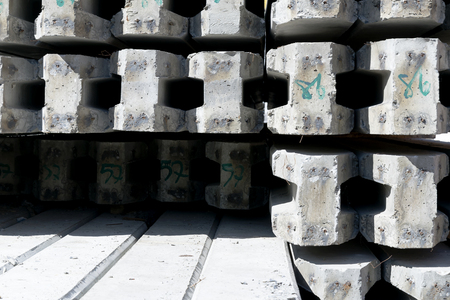 Excavate concrete pile stake in front of the house to support the strength of the mortar, Under constructional house with unfinished steel stakes

の写真素材