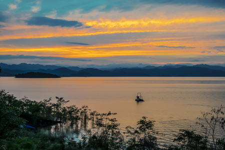 Sunset at Kaengkrachan National Park ,Chaipattana low speed surface aerator to pump oxygen into wastewater designed and developed by his Majesty the King Bhumibol Adulyadej of Thailand.の写真素材