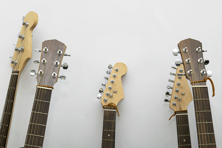 guitar closeup in the studio,Neck of a guitar with strings and head in the background,Musical instrument,Vintage colors,Detail of acoustic guitar,wooden guitar,の写真素材