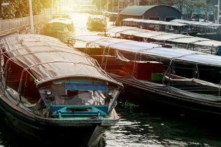 Marina Passenger boat,Thai lifestyle between the old wooden house of people and the temple to living along the San-Sab canal : Bangkok ,Thailandの写真素材