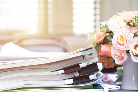 Pile of unfinished documents on office desk, Stack of business paper, Morning in the morning On the...