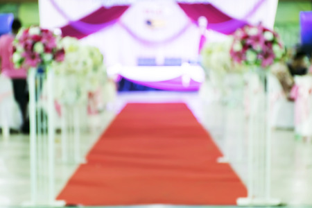 Blur Beautiful flowers background for wedding scene,Happy outdoor Wedding Ceremony Scene for a summer mountain wedding,decorated wedding alter and flower decorations with mountains in the background.の写真素材