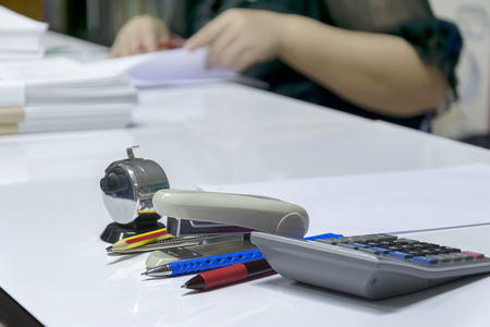 Office equipment is important to help make the job even more effective, pen, scissors, calculator, calculator, counting machine, A reminder paper, Cutting, The paper-clip.の写真素材