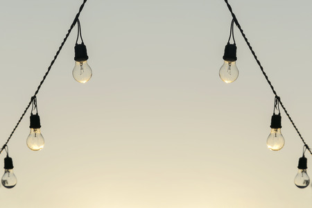 Idea concept,Old light bulb,Decorative antique edison style light bulbs against brickの写真素材