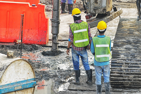 Inspection Engineer Large construction,There is a ground excavation for the construction,Explore safety and accuracy.の写真素材