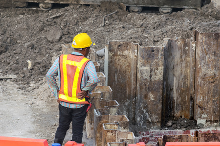 Inspection Engineer Large construction,There is a ground excavation for the construction,Explore safety and accuracy.の写真素材