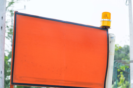 Siren flashing light on top Warning sign,The background is orange to enter text,Located outside the workplace.の写真素材