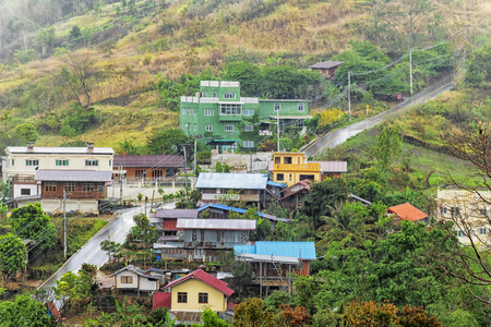 The hillside village is a rural lifestyle.The road is long.The rain is heavy.Fog in mountains. Fantasy and colorful nature landscape.の写真素材