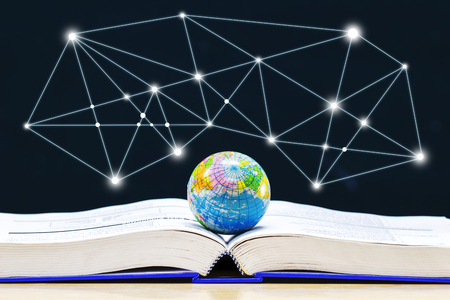 Globe placed on the book,Open book on the table,Lines of light like a star Created from the program.