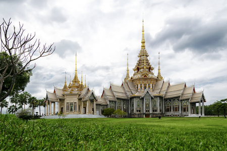 Main building of Non Kum Temple during daytime with a pool and background of cloudy blue sky,  Na-khon Rat-cha-si-ma, Thailand.のeditorial素材
