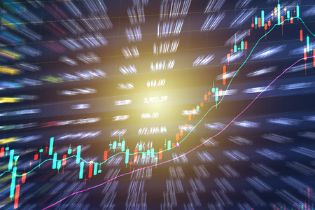 Candle stick graph chart of stock market investment trading.Double exposure of stocks market chart and stock data in blue on LED display concept.の写真素材