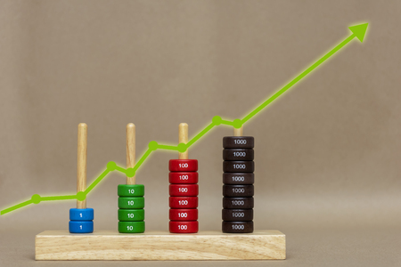 Businessman plan graph growth and increase of chart positive indicators in his business. Compare stock growth stocks.の写真素材