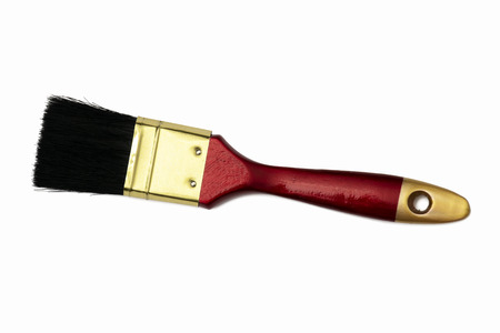 Paint brush is Gold and red, Handle made of wood, The bristles look black. An aluminous plate is a fastener.の写真素材