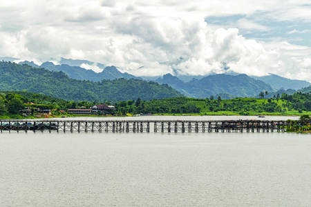 The old wooden bridge collapse across the river (Mon bridge )at sangklaburi, kanchanaburi, Province Asia thailand. Morning atmosphere.のeditorial素材