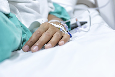 Patients who are recovering from illness. Give the saline arm. Medical treatment by specialist.の写真素材