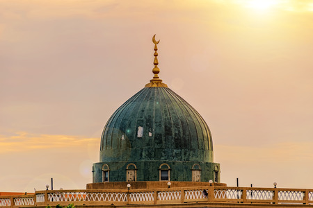 Crescent moon at a top of a mosque. Light of hope. The mosque it is an important Islamic place. It is beautiful for the sight in Twilight .のeditorial素材