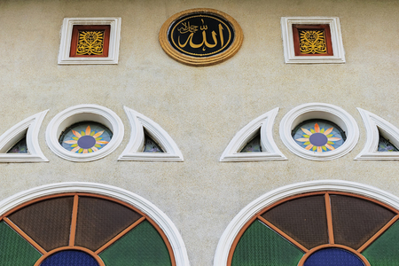 Islamic calligraphy and symbols adorns the walls. The mosque it is an important Islamic place. Windows with beautiful colors, Symbols is Allah is the name of the God of Islam.のeditorial素材