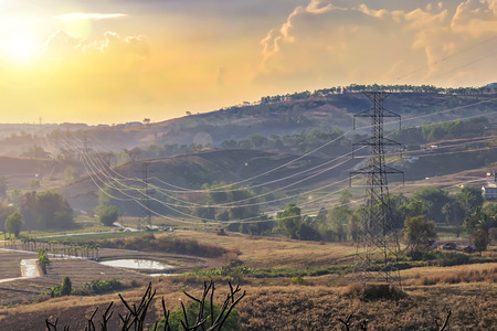 Energy concept, Electric power is necessary. Electric travel with high power poles. To put together in Beautiful Valley Nature.の写真素材