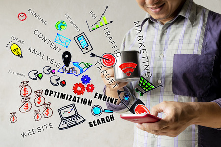 SEO concept. Men who are drinking water with relaxation. Find information on his smartphone. by Search Engine Optimization Graphic to get effective information.の写真素材