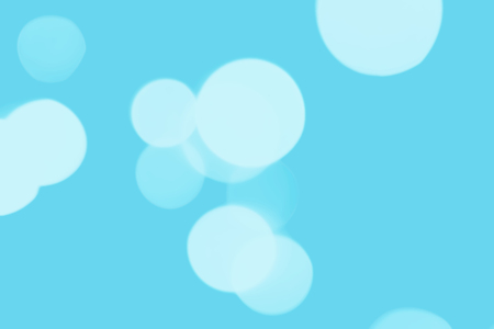 Blue abstract bokeh background. Floating in the air. light on light blue backgroundの写真素材