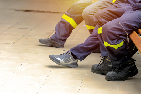 Firefighter, fireman. Emergency safety. Protection, rescue from danger. Fire fighter in protective helmet. Adult man, hero in equipment, uniform at work.Take a break from heavy work.の写真素材