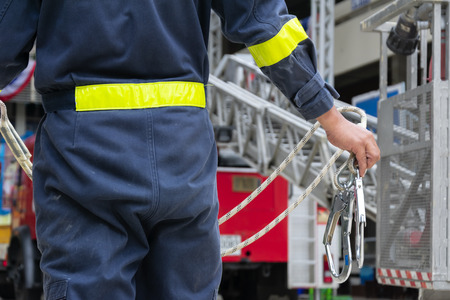 Firefighters are installing safety equipment. To prevent harm from duty.The standard is universally accepted.の写真素材