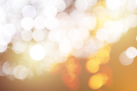 Orange abstract bokeh background. Floating in the air.の写真素材