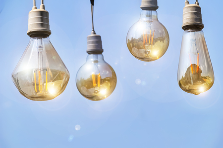 Energy concept. Lighting is what man wants. The light bulb is what gives us light. Reflected with the sun until the phenomenon of glow.の写真素材
