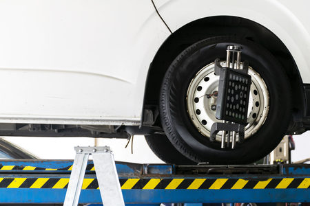 Wheel alignment by specialist technicians. Safety is a must, because the wheel is the heart of the car.の写真素材