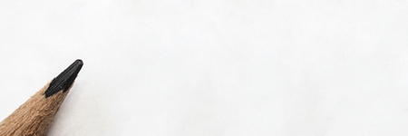 Closeup pencil placed on white paper Panorama images have space to enter text. Used as advertising media. The pencil looks blunt at the end from the use.の写真素材